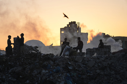 Palestinians search for firewood and plastic at a landfill in Gaza City Saturday, Oct. 25, 2025. (AP Photo/Abdel Kareem Hana) Palestinians search for firewood and plastic at a landfill in Gaza City Saturday, Oct. 25, 2025. (AP Photo/Abdel Kareem Hana)