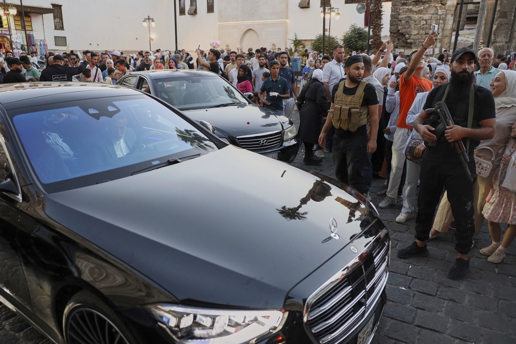 The convoy carrying Emirati business magnate Khalaf al-Habtoor, chairman of the Al Habtoor Group, arrives for a visit to the Umayyad Mosque as part of a delegation trip to explore investment opportunities in Syria, in the Old City of Damascus on Tuesday, Sept. 9, 2025.(AP Photo/Omar Albam)