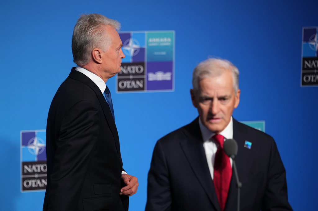 Norway's Prime Minister Jonas Gahr Store, right, speaks with the media as Lithuania's President Gitanas Nauseda, left, arrives for the NATO summit in Ankara, Turkey, Wednesday, July 8, 2026. (AP Photo/Emrah Gurel)