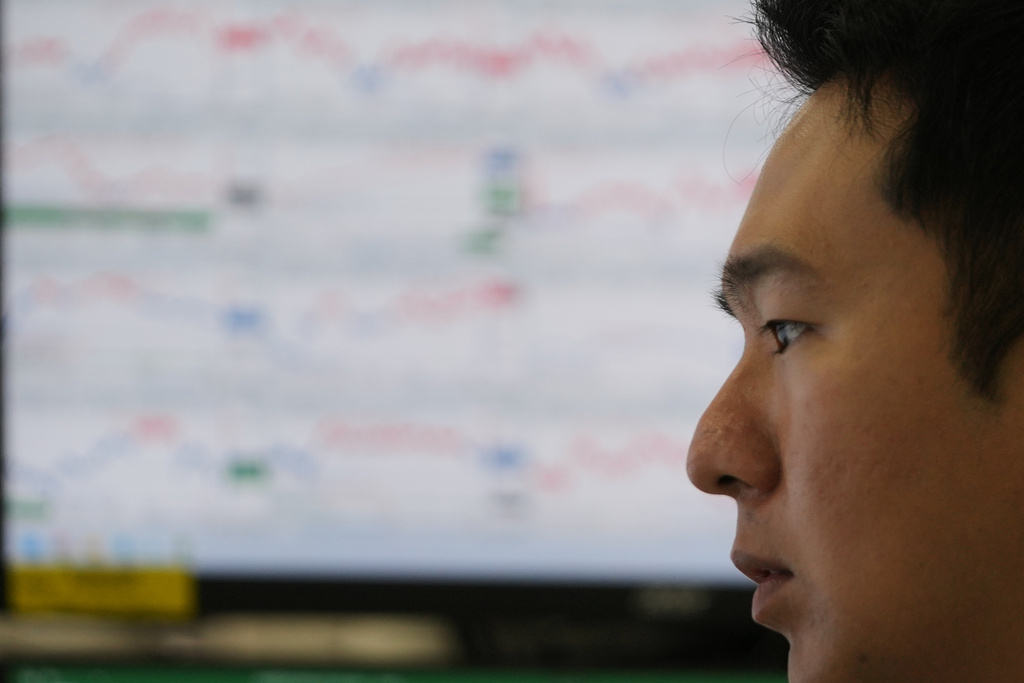 A dealer watches computer monitors at a dealing room of Hana Bank in Seoul, South Korea, Friday, Nov. 7, 2025. (AP Photo/Lee Jin-man)
