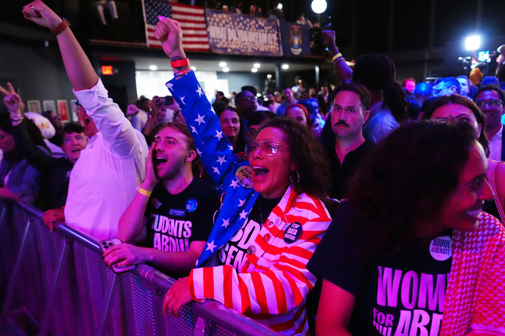 Attendees react to election results during a primary election night event for Abdul El-Sayed, a progressive candidate in the Democratic primary for U.S. Senate in Michigan, Tuesday, Aug. 4, 2026, at the Majestic Theatre in Detroit. (AP Photo/Julia Demaree Nikhinson)