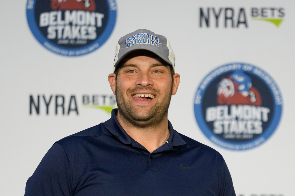 Trainer Brad Cox smiles after randomly during the post position draw ahead of the Belmont Stakes horse race, Tuesday, June 6, 2023, at Belmont Park in Elmont, N.Y. (AP Photo/John Minchillo, File)