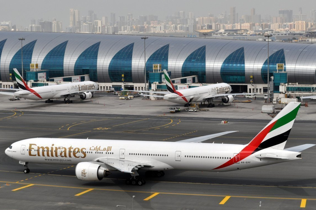 FILE -- In this March 22, 2017 file photo, an Emirates plane taxis to a gate at Dubai International Airport at Dubai International Airport in Dubai, United Arab Emirates. (AP Photo/Adam Schreck, File)