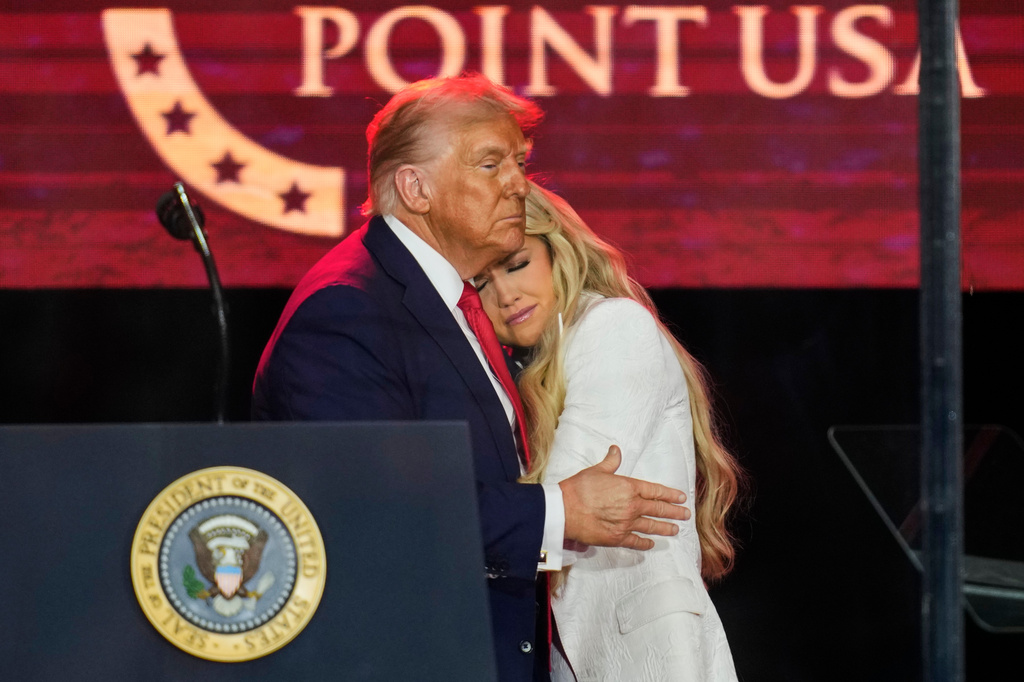 FILE - President Donald Trump embraces Erika Kirk at a memorial for conservative activist Charlie Kirk, Sept. 21, 2025, at State Farm Stadium in Glendale, Ariz. (AP Photo/John Locher, File)