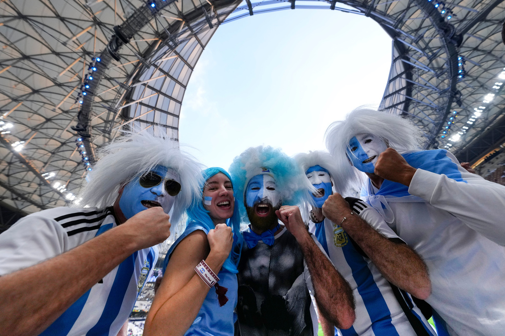 FILE - Argentinian fans cheer before the the World Cup final soccer match between Argentina and France at the Lusail Stadium in Lusail, Qatar, Dec. 18, 2022. (AP Photo/Petr David Josek, File)