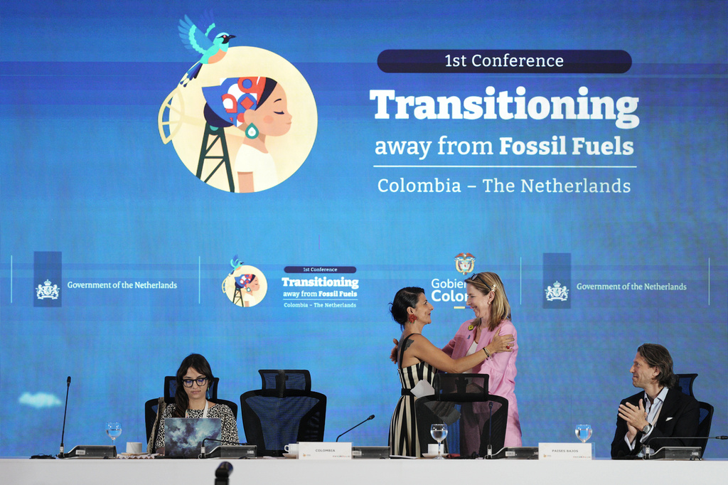 Stientje van Veldhoven, Minister of Climate Policy and Green Growth of the Netherlands, right, embraces Colombia's Environmental Minister Irene Vélez Torres during a conference aimed at transitioning away from fossil fuels Tuesday, April 28, 2026, in Santa Marta, Colombia. (AP Photo/Ivan Valencia)