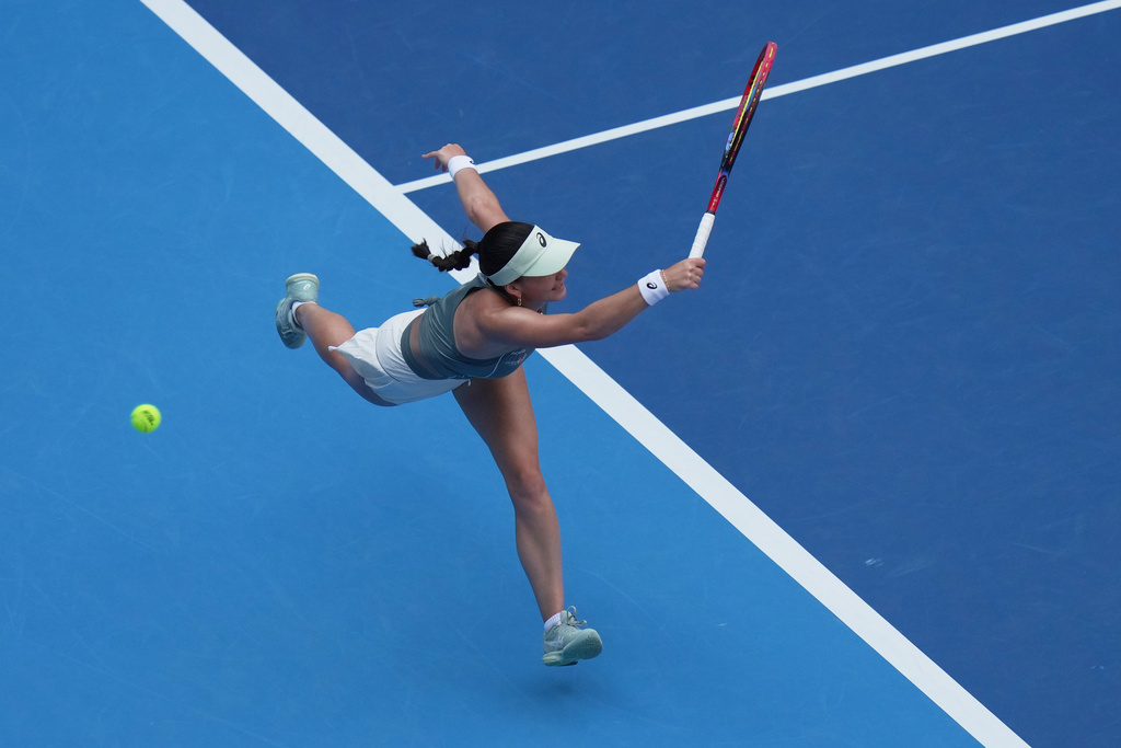 Eva Lys, of Germany misses the serves from Coco Gauff, of the United States during the women's singles quarterfinals match of the China Open tennis tournament, at the National Tennis Center, in Beijing, Thursday, Oct. 2, 2025. (AP Photo/Andy Wong)