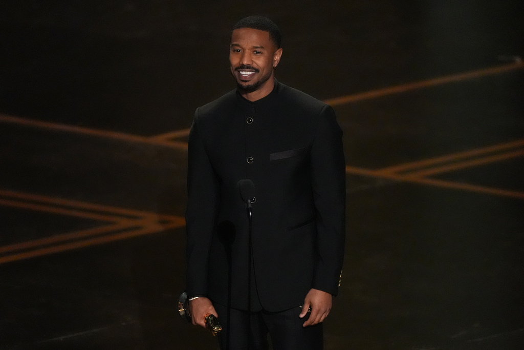 Michael B. Jordan accepts the award for actor in a leading role for "Sinners" during the Oscars on Sunday, March 15, 2026, at the Dolby Theatre in Los Angeles. (AP Photo/Chris Pizzello)
