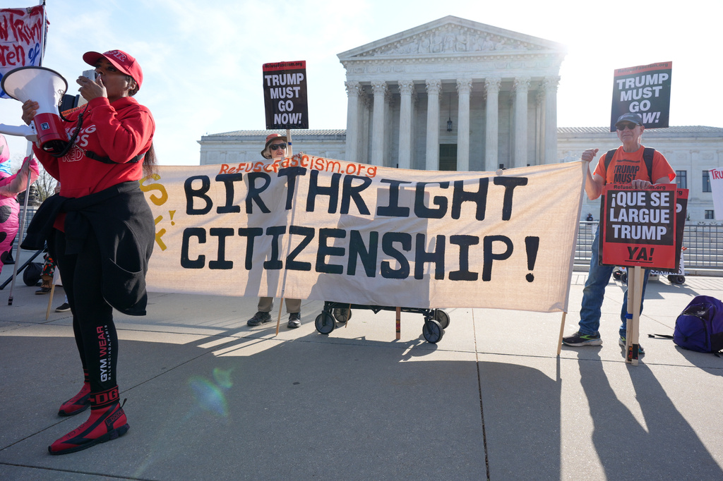 Pro and anti-Trump demonstrators rally outside the U.S. Supreme Court, before justices hear oral arguments on whether President Donald Trump can deny citizenship to children born to parents who are in the United States illegally or temporarily, on Capitol Hill, in Washington, Wednesday, April 1, 2026. (AP Photo/J. Scott Applewhite)