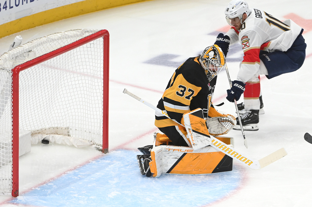 Florida Panthers left wing A.J. Greer (10) scores on Pittsburgh Penguins goalie Arturs Silovs (37) during the first period of an NHL game, Saturday, April 4, 2026, in Pittsburgh. (AP Photo/Philip G. Pavely)