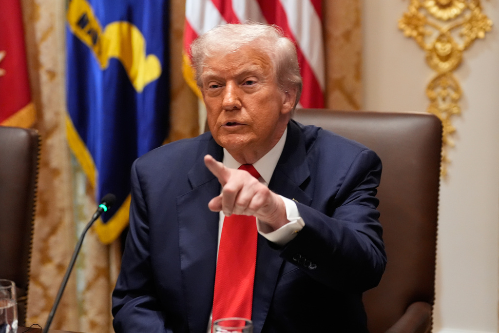 President Donald Trump speaks during a meeting with Argentina's President Javier Milei in the Cabinet Room of the White House, Tuesday, Oct. 14, 2025, in Washington. (AP Photo/Alex Brandon)
