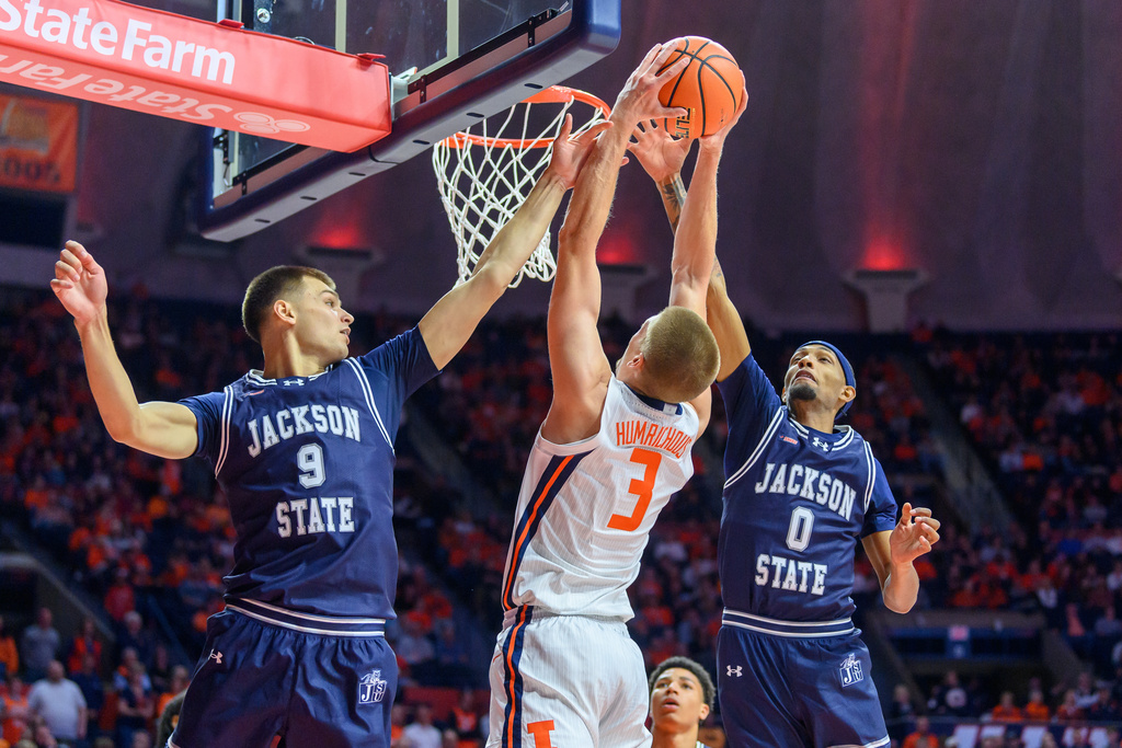 Jackson State's Deyan Kolev (9) and Tamarion Hoover (0) battle for a rebound with Illinois' Ben Humrichous during an NCAA college basketball game Monday, Nov. 3, 2025, in Champaign, Ill. (AP Photo/Craig Pessman)