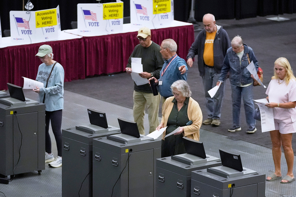 FILE - Voter cast their Maine primary ballots at the Civic Center, June 9, 2026, in Augusta, Maine. (AP Photo/Robert F. Bukaty, File)