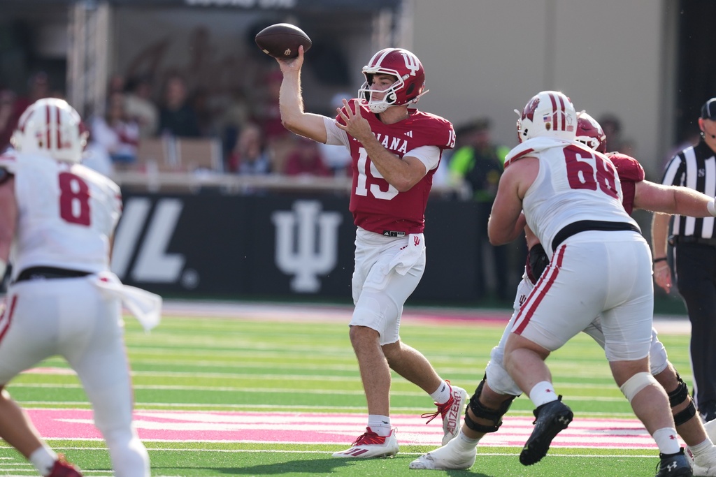 Indiana quarterback Fernando Mendoza (15) throws a pass during the second half of an NCAA college football game against Wisconsin, Saturday, Nov. 15, 2025, in Bloomington, Ind. (AP Photo/Darron Cummings)