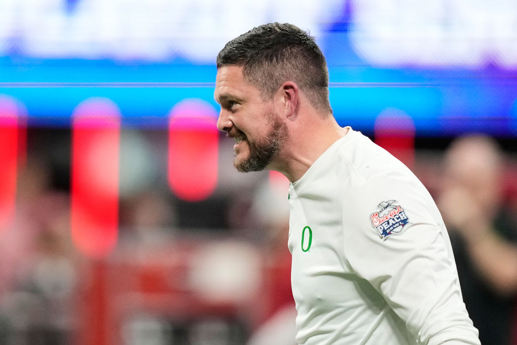 Oregon head coach Dan Lanning walks on the field before the Peach Bowl NCAA college football playoff semifinal against Indiana, Friday, Jan. 9, 2026, in Atlanta. (AP Photo/Brynn Anderson)