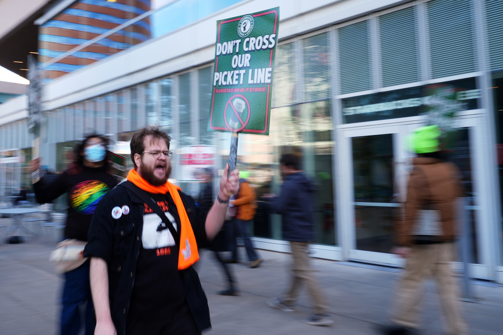 A protester chants during a picket outside a Starbucks, Thursday, Nov. 13, 2025, in Philadelphia. (AP Photo/Matt Slocum)