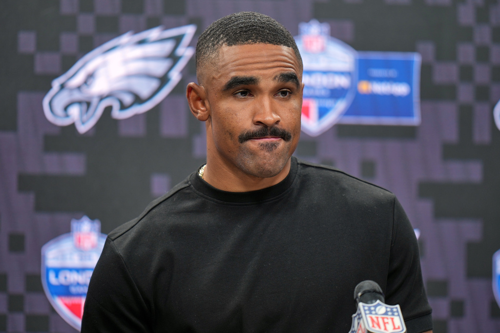 Philadelphia Eagles quarterback Jalen Hurts (1) attends a press conference after an NFL football game against Jacksonville Jaguars in London, Sunday, Oct. 11, 2026. (AP Photo/Alastair Grant)