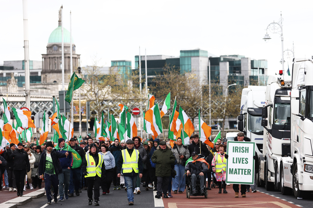 Protesters make their way to O'Connell Street during the fifth day of a National Fuel Protest, in Dublin, Ireland, Saturday, April 11, 2026. (AP Photo/Peter Morrison)
