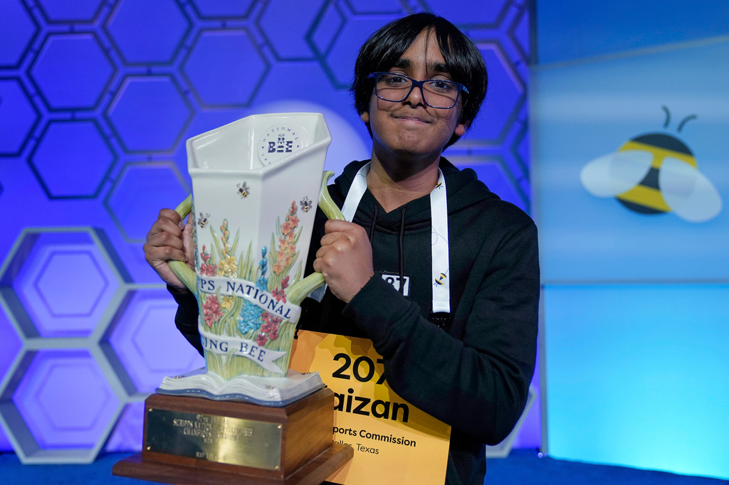 FILE - Faizan Zaki, 13, of Dallas, holds the trophy after winning the 2025 Scripps National Spelling Bee, Thursday, May 29, 2025, in Oxon Hill, Md. (AP Photo/Jose Luis Magana, File)