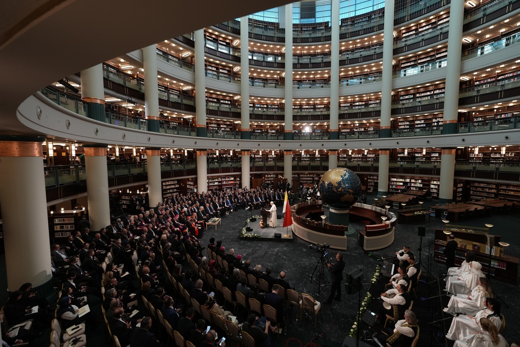 Pope Leo XIV delivers his speech as he meets with authorities, members of the civil society and diplomats in the Presidential Palace's national library, in Ankara, Turkey, Thursday, Nov. 27, 2025. (AP Photo/Domenico Stinellis)