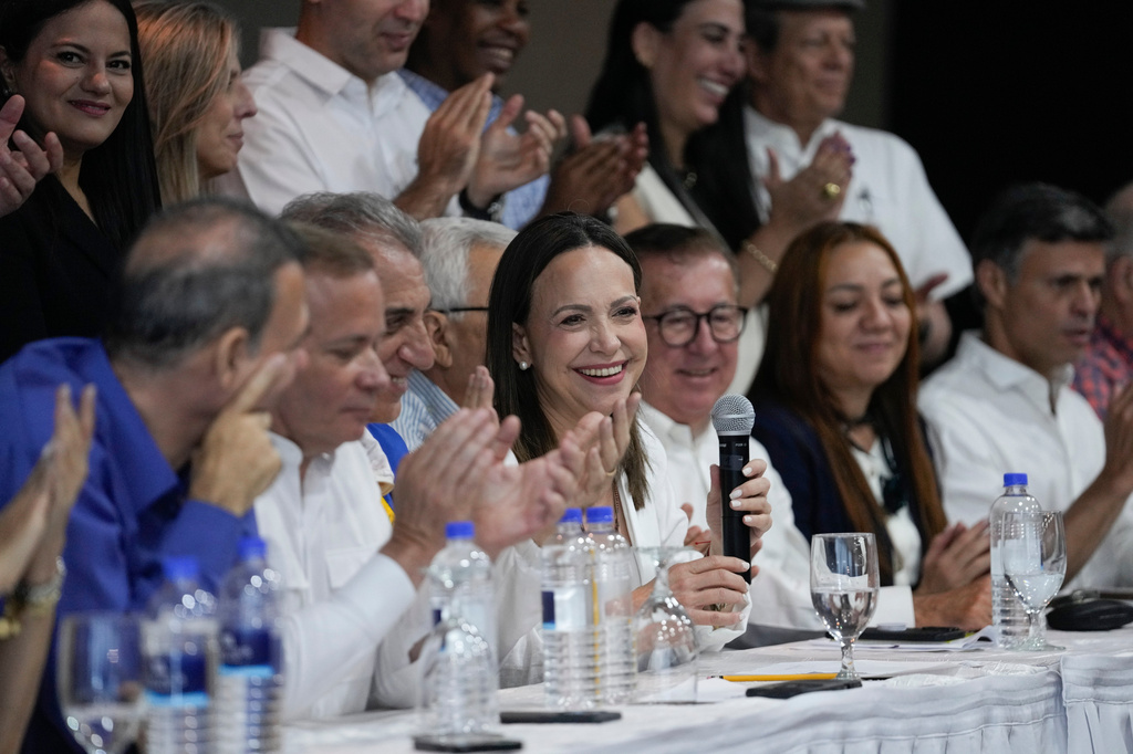 Venezuela's opposition leader Maria Corina Machado, center, attends a press conference in Panama City, Saturday, May 23, 2026. (AP Photo/Matias Delacroix)
