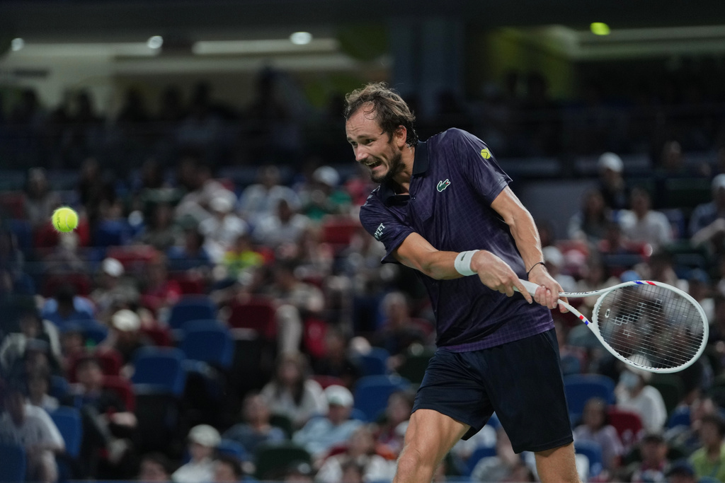 Daniil Medvedev of Russia prepares to return a backhand shot from Alex De Minaur of Australia during their men's singles quarterfinal match of the Shanghai Masters tennis tournament at Qizhong Forest Sports City Tennis Center, in Shanghai, China, Friday, Oct. 10, 2025. (AP Photo/Andy Wong)