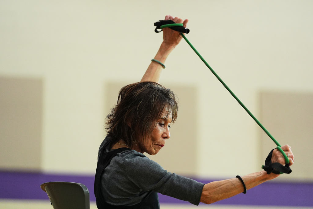 Instructor Bengie Santos, 72, leads a class for older adults at the Dale Turner Family YMCA, April 30, 2026, in Shoreline, Wash. (AP Photo/Lindsey Wasson)