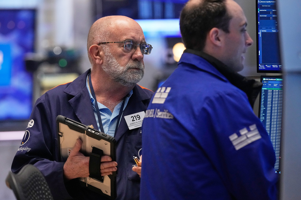 Trader Joseph Stevens, left, works on the floor of the New York Stock Exchange, Tuesday, May 5, 2026. (AP Photo/Richard Drew)