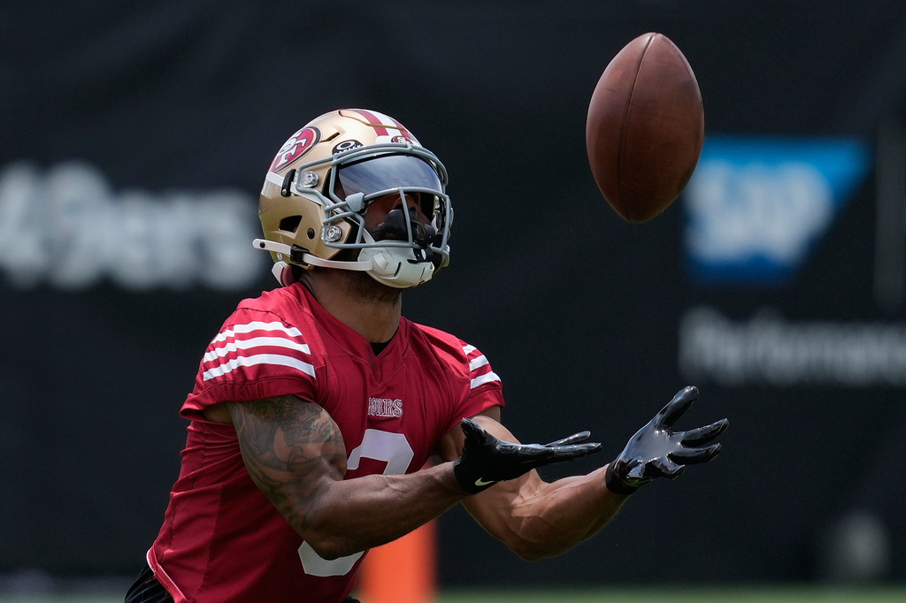 FILE - San Francisco 49ers' Christian Kirk catches a ball during NFL football practice May 28, 2026, in Santa Clara, Calif. (AP Photo/Jeff Chiu, File)