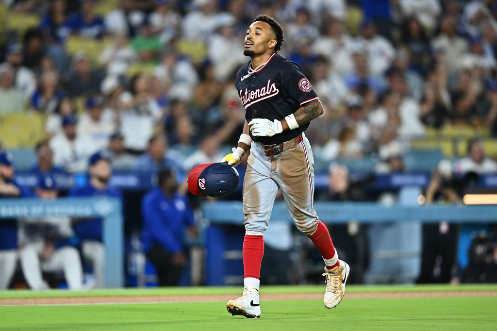 Washington Nationals' Nasim Nuñez runs back to the dugout after being caught stealing during the third inning of a baseball game against the Los Angeles Dodgers, Friday, Sept. 4, 2026, in Los Angeles. (AP Photo/William Liang)