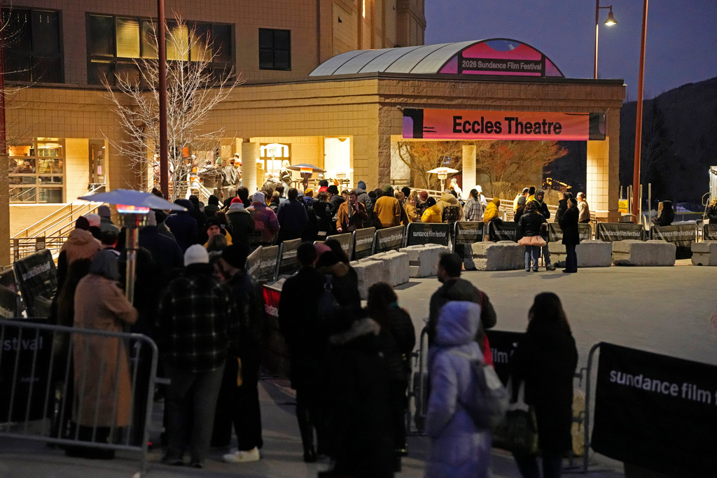 Audience members line up outside the Eccles Theatre during the Sundance Film Festival on Friday, Jan. 23, 2026, in Park City, Utah. (Photo by Charles Sykes/Invision/AP)