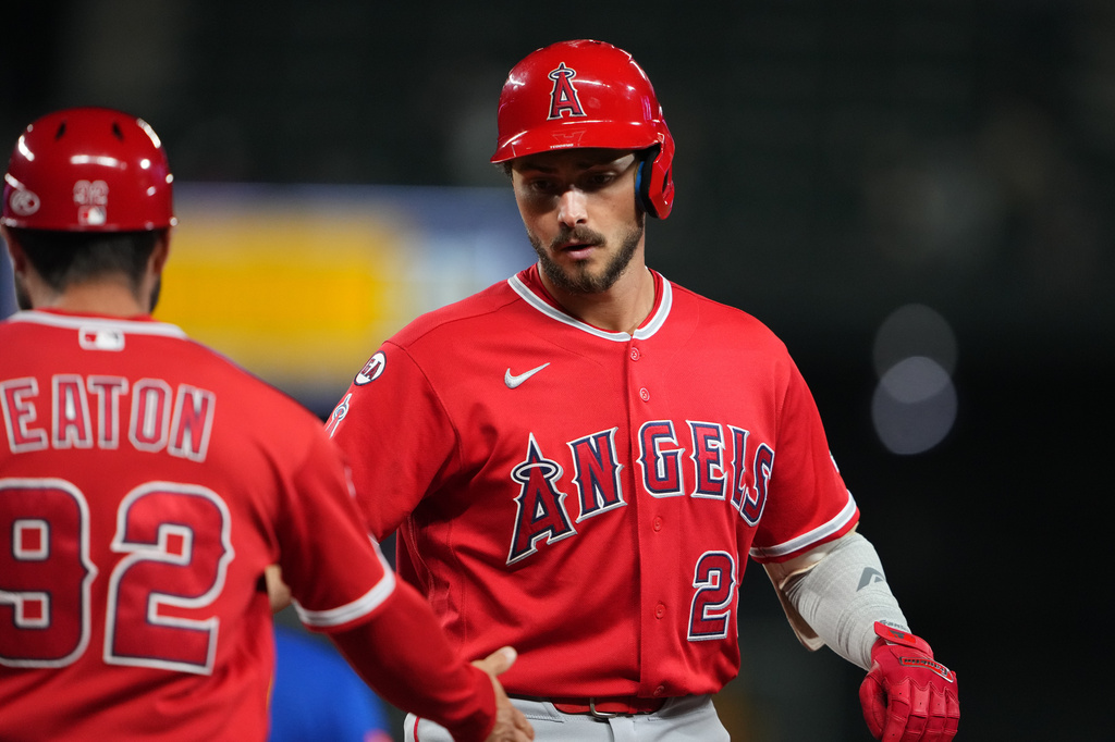 Los Angeles Angels' Bryce Teodosio celebrates an RBI single with first base/outfield coach Adam Eaton (92) during the eighth inning of a baseball game against the Seattle Mariners, Thursday, Sept. 24, 2026, in Seattle. (AP Photo/Lindsey Wasson)