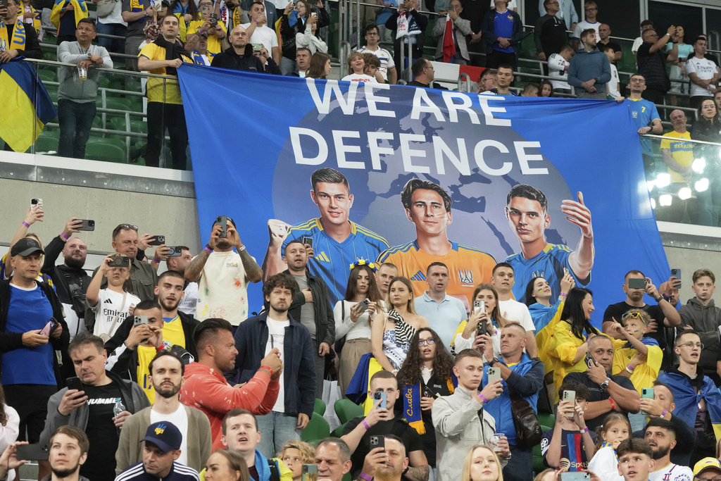 Ukraine fans wait for the start of the 2026 FIFA World Cup qualifying soccer match between Ukraine and France at Tarczynski Arena in Wroclaw, Poland, Friday, Sept. 5, 2025. (AP Photo/Czarek Sokolowski)