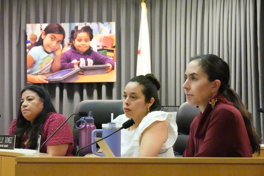 Los Angeles Unified School District board members from left, Karla Griego, Kelly Gonez, and Tanya Ortiz Franklin listen to public comments during a meeting at LAUSD headquarters before a special closed session with LAUSD Superintendent Alberto Carvalho, Thursday, Feb. 26, 2026, in Los Angeles. (AP Photo/Damian Dovarganes)