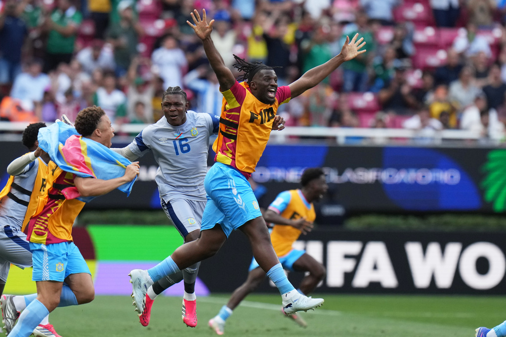 DR Congo's Rocky Bushiri, front, and teammates celebrate at the end of the World Cup playoff final soccer match between DR Congo and Jamaica in Guadalajara, Mexico, Tuesday, March 31, 2026. (AP Photo/Eduardo Verdugo)