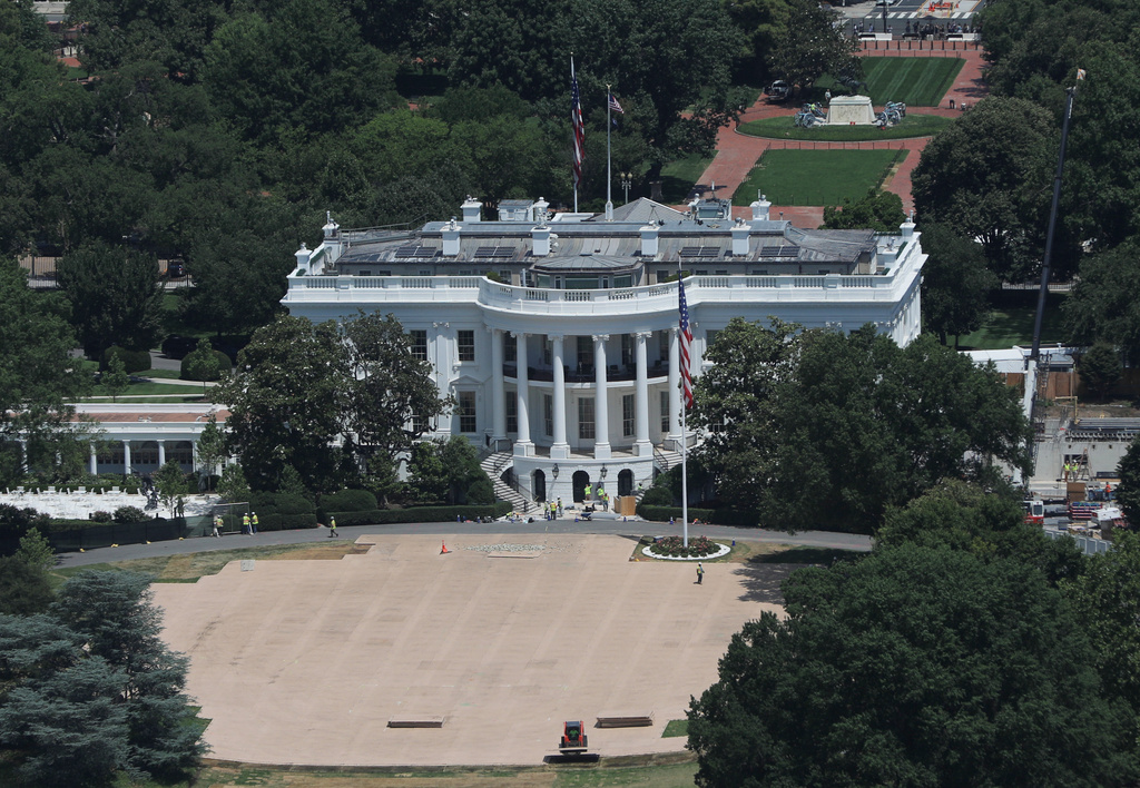 FILE - The last remaining pieces built on the South Lawn of the White House for the UFC Freedom 250 event are removed, June 24, 2026, in Washington. (AP Photo/Rahmat Gul, File)