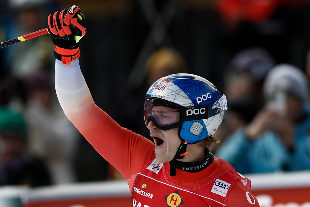 Switzerland's Marco Odermatt celebrates at the finish area of an alpine ski, men's World Cup downhill, in Val Gardena, Italy, Thursday, Dec. 18, 2025. (AP Photo/Gabriele Facciotti)