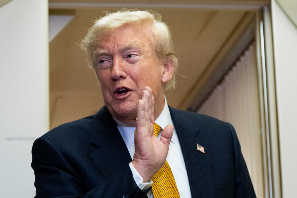 President Donald Trump speaks with reporters in flight on Air Force One after landing at U.S. Air Force Base at RAF Mildenhall, in Suffolk, Eastern England, Wednesday, July 8, 2026. (AP Photo/Alex Brandon)