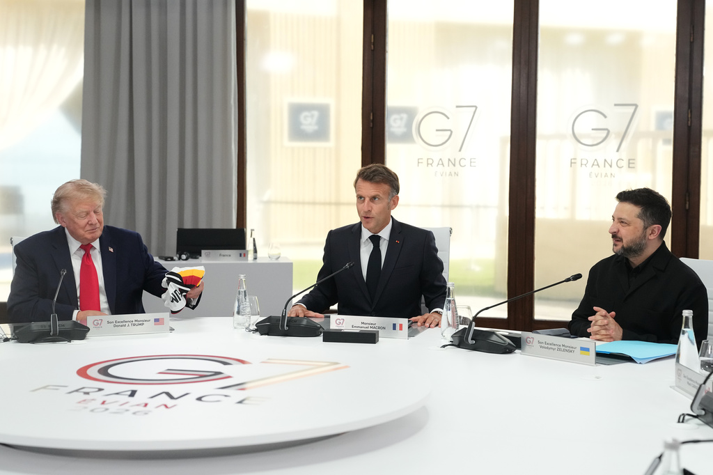 From left, U.S. President Donald Trump, French President Emmanuel Macron and Ukrainian President Volodymyr Zelenskyy during a working session at the G7 summit in Evian-les-Bains, France, Tuesday, June 16, 2026. (AP Photo/Thibault Camus, Pool)
