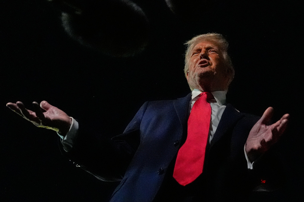 President Donald Trump speaks to reporters before boarding Air Force One at Palm Beach International Airport, Monday, Jan. 19, 2026, in West Palm Beach, Fla. (AP Photo/Julia Demaree Nikhinson)