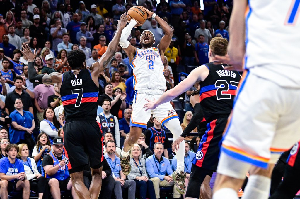 Oklahoma City Thunder guard Shai Gilgeous-Alexander (2) shoots against Detroit Pistons forward Paul Reed (7) during the second half of an NBA basketball game Monday, March. 30, 2026, in Oklahoma City. (AP Photo/Gerald Leong)