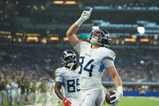 Tennessee Titans tight end Gunnar Helm (84) celebrates a touchdown catch during the first half an NFL football game against the Indianapolis Colts, Sunday, Oct. 26, 2025, in Indianapolis. (AP Photo/Michael Conroy) Tennessee Titans tight end Gunnar Helm (84) celebrates a touchdown catch during the first half an NFL football game against the Indianapolis Colts, Sunday, Oct. 26, 2025, in Indianapolis. (AP Photo/Michael Conroy)