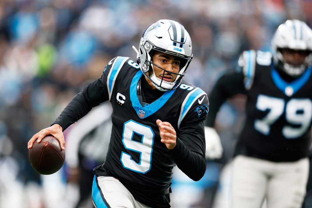Carolina Panthers quarterback Bryce Young runs against the Los Angeles Rams during the first half of an NFL football game, Sunday, Nov. 30, 2025, in Charlotte, N.C. (AP Photo/Rusty Jones)