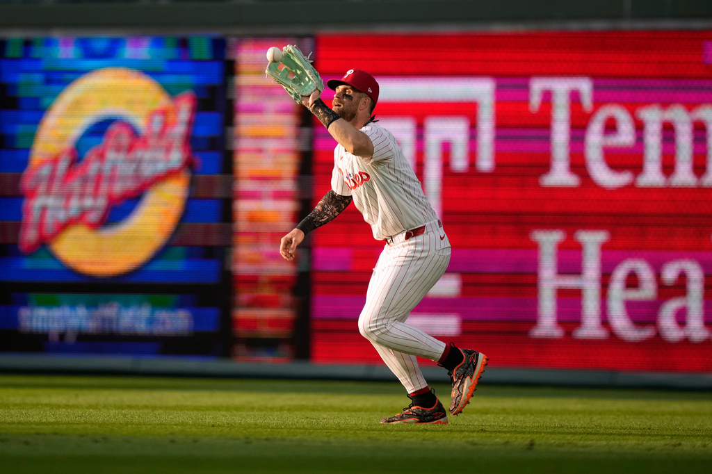 Philadelphia Phillies right fielder Bryce Harper catches a line out by Washington Nationals' Harry Ford during the second inning of a baseball game Tuesday, Aug. 4, 2026, in Philadelphia. (AP Photo/Matt Slocum)