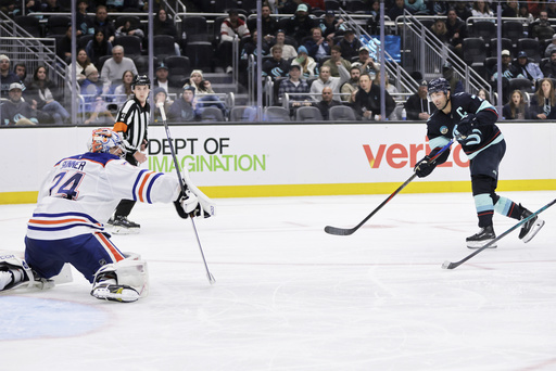 Seattle Kraken right wing Jordan Eberle (7) scores against Edmonton Oilers goaltender Stuart Skinner (74) in the third period of an NHL hockey game Saturday, Oct. 25, 2025, in Seattle. (AP Photo/John Froschauer) Seattle Kraken right wing Jordan Eberle (7) scores against Edmonton Oilers goaltender Stuart Skinner (74) in the third period of an NHL hockey game Saturday, Oct. 25, 2025, in Seattle. (AP Photo/John Froschauer)