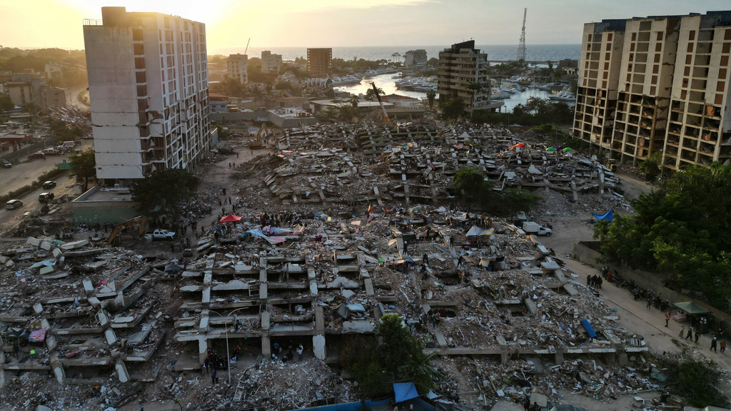 FILE - Buildings lie in ruins after twin earthquakes in La Guaira, Venezuela, July 7, 2026. (AP Photo/Ariana Cubillos, File)