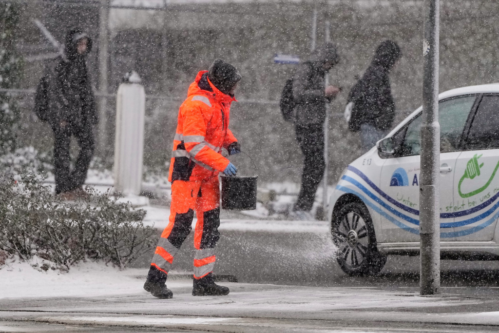 FILE - Salt is spread on a street in Gelsenkirchen, Germany, Jan. 7, 2026. (AP Photo/Martin Meissner, File)