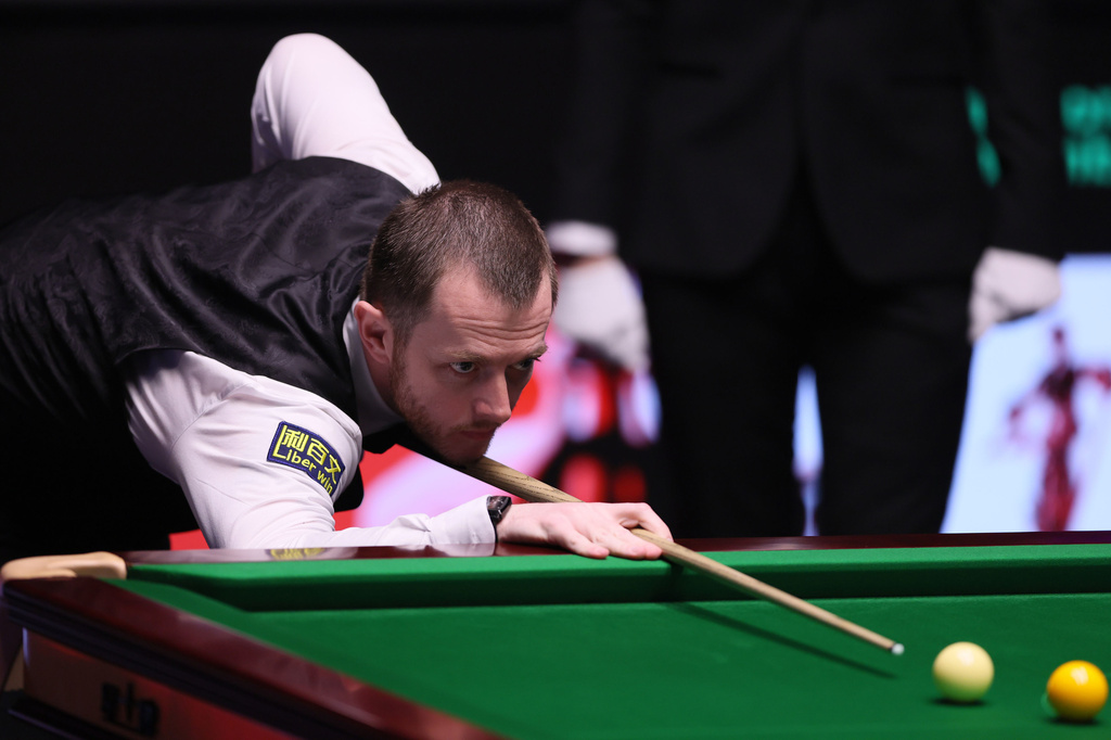 Mark Allen plays a shot during his match against Wu Yize on day fifteen of the World Snooker Championship 2026, in Sheffield, England, Saturday May 2, 2026. (Richard Sellers/PA via AP)