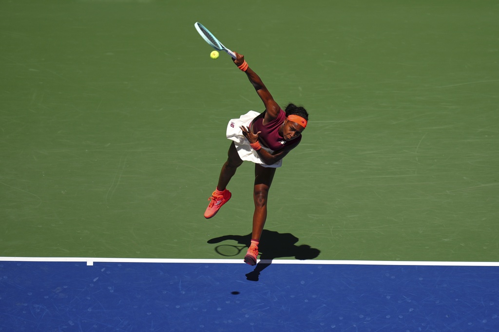 Coco Gauff, of the United States, serves against Magdalena Frech, of Poland, during the third round of the U.S. Open tennis championships, Saturday, Aug. 30, 2025, in New York. (AP Photo/Kirsty Wigglesworth)