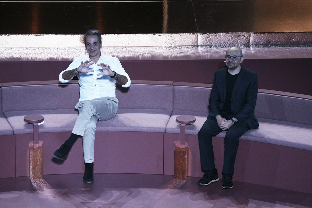 Greece's Prime Minister Kyriakos Mitsotakis, left, and Demis Hassabis, CEO of Google's artificial intelligence research company DeepMind discuss the future of AI, ethics and democracy during an event at the Odeon of Herodes Atticus, in Athens, Greece, Friday, Sept. 12, 2025. (AP Photo/Thanassis Stavrakis)
